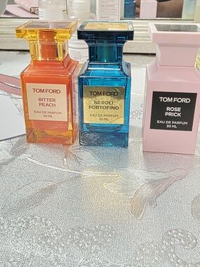 Tom Ford trio — Orange, Blue & Pink parfum bottles